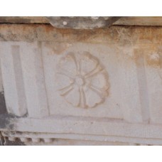 Flower-like solar disc on a marble stone
